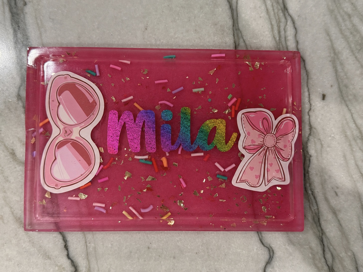 Pink resin trinket tray personalized with the name Mila